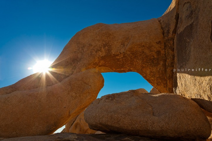 Arch Rock sun flare, Joshua Tree National Park in California - Paul Reiffer - Professional London Landscape Photographer