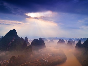 portal guilin xingping mountains Laozhai river li sunrise clouds storm rock formations paul reiffer professional landscape photographer china guangxi	