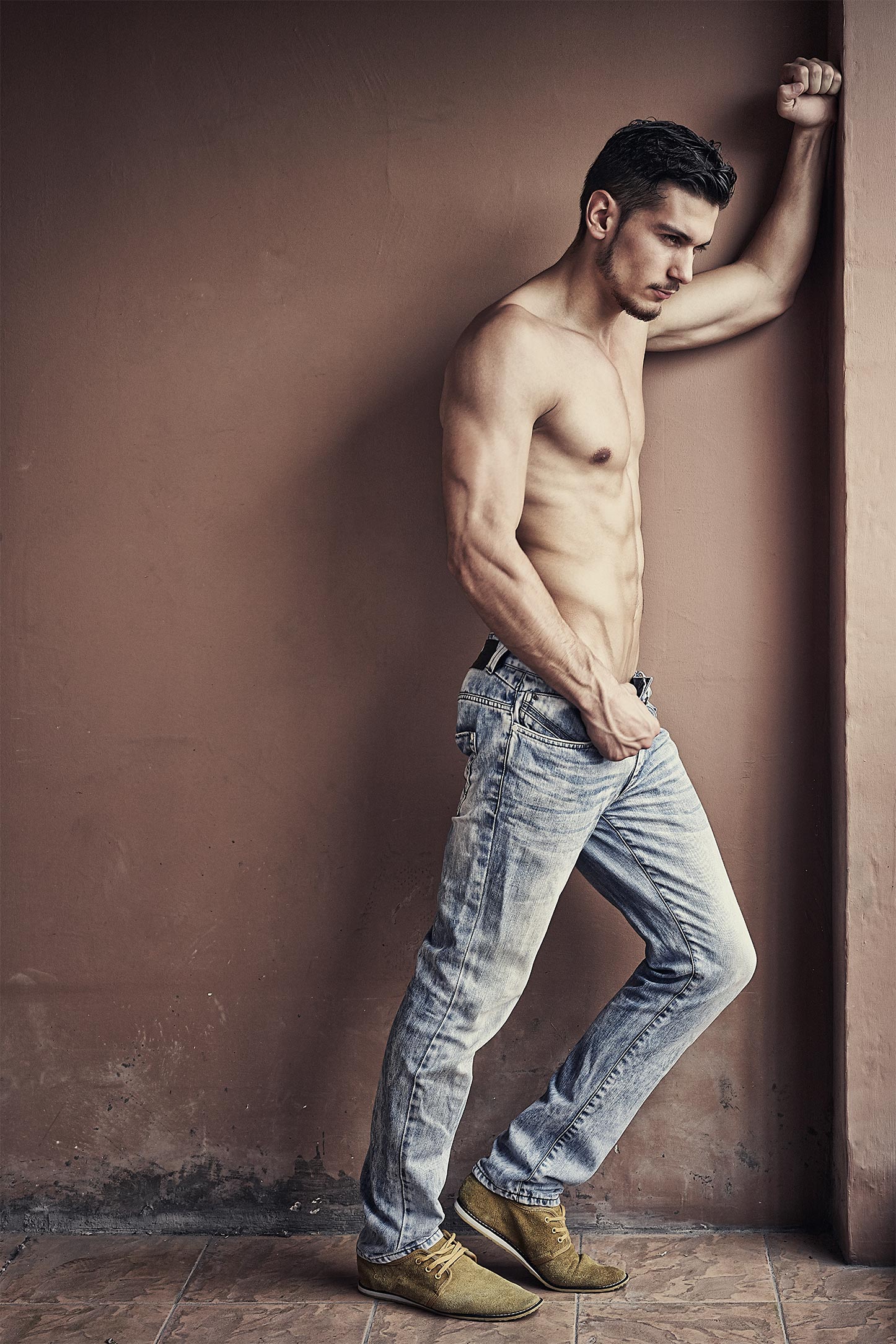 Portrait of a Young Physically Fit Man Showing His Well Trained Body While  Wearing Black Jeans - Muscular Athletic Bodybuilder Fitness Model Posing Ou  Stock Photo - Alamy