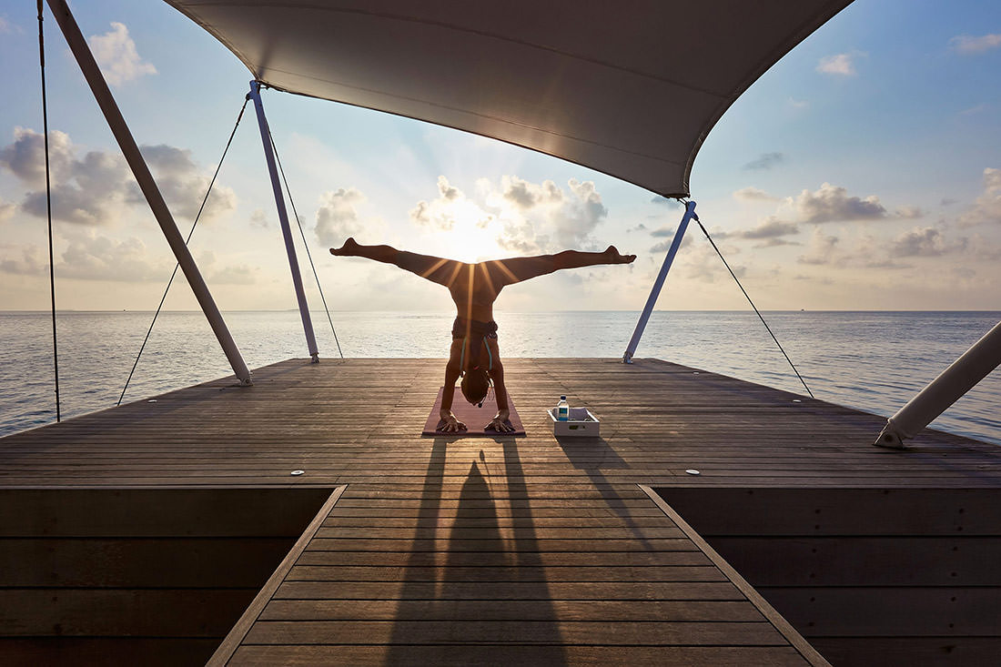 Sunrise Yoga Tara Styles Upside Down Reverse Splits Jetty W Maldives Retreat Hotel Resort Sun Flare Paul Reiffer Photographer