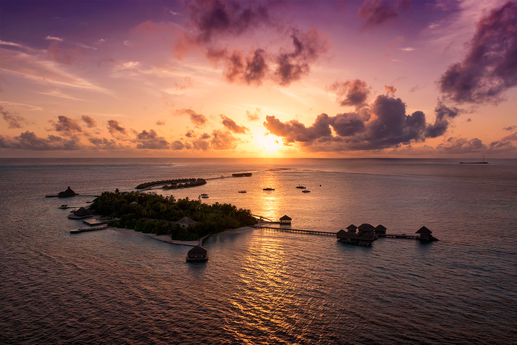 huvafen fushi per aquum maldives island resort aerial sunset shot professional photography paul reiffer landscape commercial parasail 1