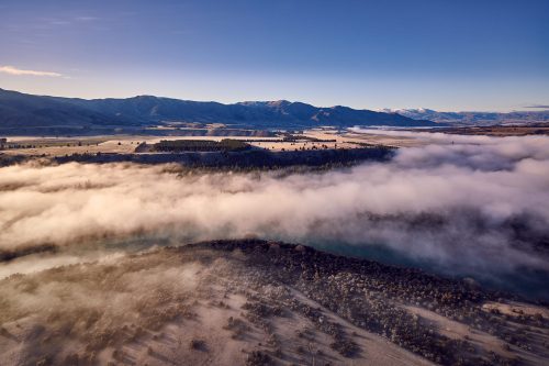 lake wanaka airport heliport helicopters roys peak excursion morning fog mist from above clouds new zealand paul reiffer