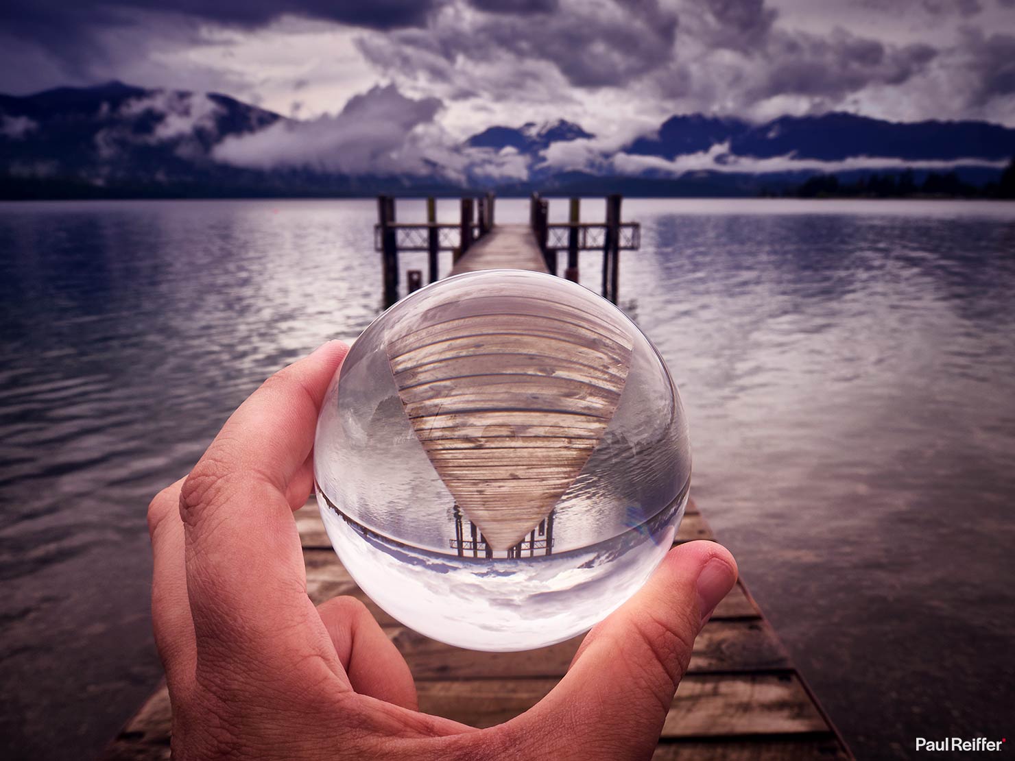 Lensball Jetty New Zealand Glass Ball Glassball Photography Paul Reiffer Handheld Stormy Sky Fisheye Wooden Pier Photographer Guide How To